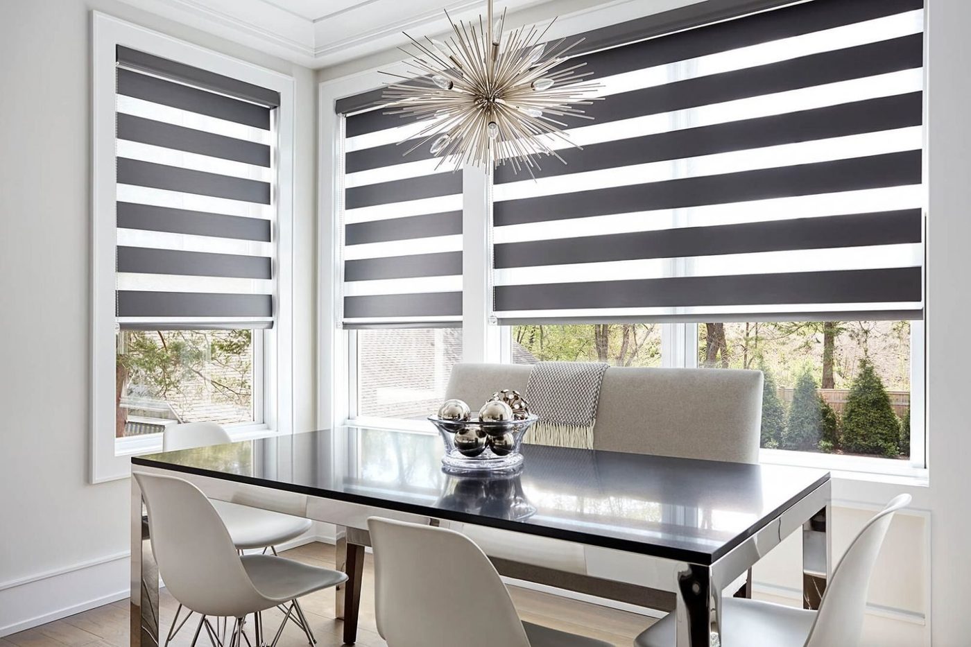 Zebra blinds — alternating opaque and sheer fabric bands for day-to-night light control