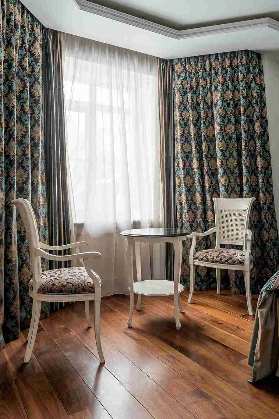 Modern blue curtains in a contemporary luxury apartment — Veloura Drapery motorized systems