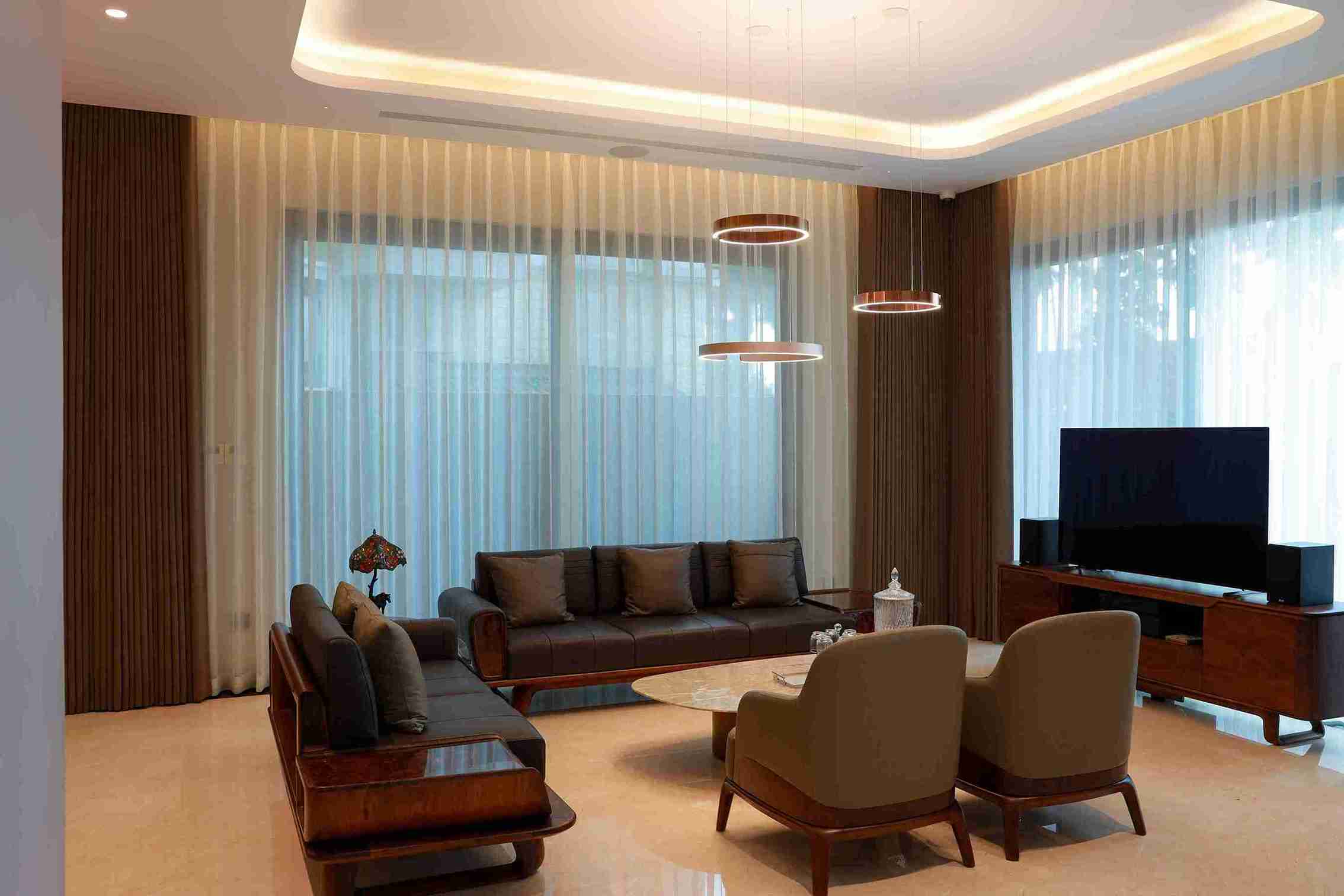 Gold patterned curtains in a designer living and dining room — Veloura Drapery